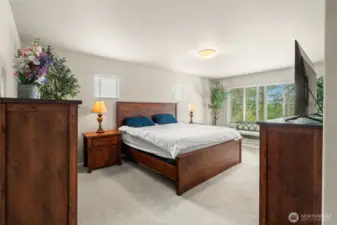 Retreat to the spacious primary suite, complete with generous natural light, serene greenbelt views, and ample room for a full bedroom set and cozy sitting area.
