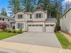 Curb appeal for days! This beautifully maintained two-story home features a 3-car garage, charming shutters, and lush landscaping—all set against a tranquil greenbelt backdrop for added privacy.