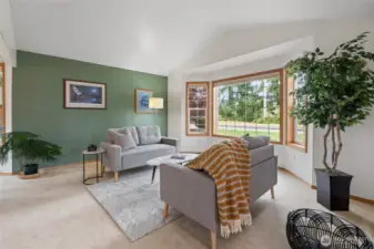 Living room with south facing windows floods the room with natural light.
