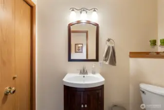 Powder room with a good sized linen closet.
