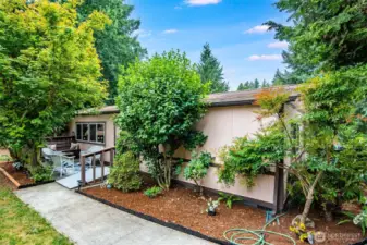 Spacious driveway and covered parking provide everyday convenience.