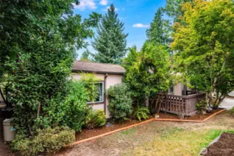 Private side yard with mature landscaping creates a peaceful retreat.