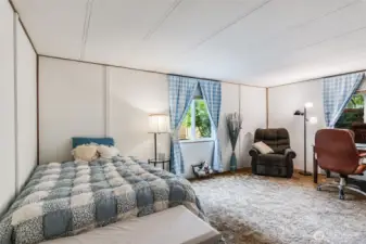 Primary suite offers plenty of room for a seating area, additional bed or home office space.