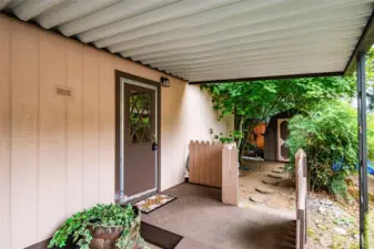 Side entry from the carport allows for sheltered access to the home.