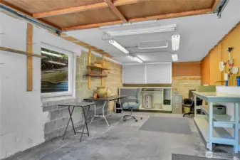 Large sisngle garage with workspace/storage.