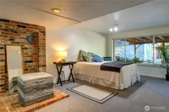 Lower level bedroom looks out to patio.