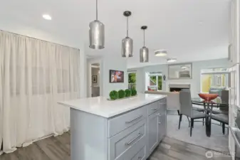 lots of easy access, drawer cabinetry under the extensive island with seating area to entertain.