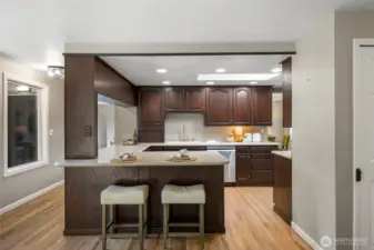 The kitchen bar and island open up into the eating area/great room