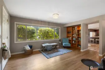 Bonus room has large windows to bring in light. The bookcases convey with the property. Its a great place to sit back and relax!