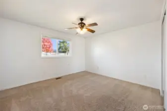 Primary bedroom with ceiling fan