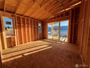 Primary suite with covered balcony area.