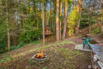 Property extends down the hill, and don't miss the fun treehouse!