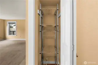 Hall closet used as pantry space.