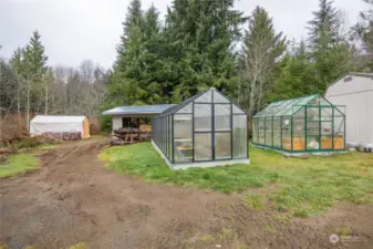 Another view of green houses and sawmill in the distance