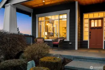 Covered front porch with lake views