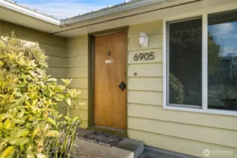Entry to level in living, dining with 3 bedrooms & 2 baths