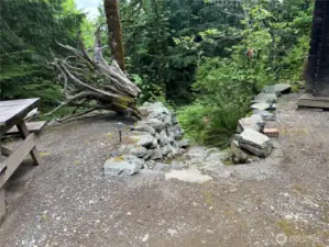 Rock stairway going to wooded area.