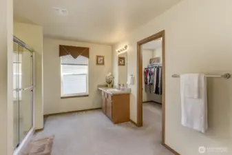 Plenty of space to relax in the Primary bathroom plus a large walk-in closet with a window.
