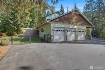 Plenty of parking, plus a massive 3 car garage with work space