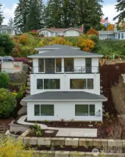 Exterior of home.  Home faces views to east of bay, city and Mt. Rainier.