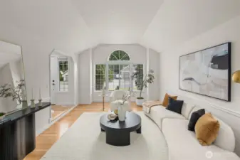 Sunshine pours into this light and bright living room, highlighting the elaborately high ceilings and gleaming hardwoods—an elegant backdrop for everyday living or effortless entertaining.