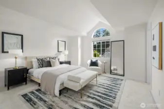 A joyful retreat, the primary suite boasts vaulted ceilings, fresh finishes, new carpet, a walk-in closet, and an attached spa-like bathroom.