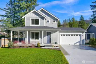 The large driveway, sprawling front yard and front deck on this home can't be beat.