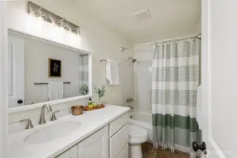 Refreshed bathroom with new vanity, new quartz countertop, new mirror, new lighting, new tub fixtures, etc!