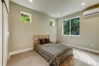 Upstairs Bedroom surrounded by trees.