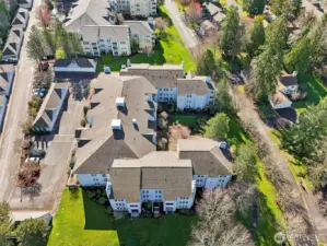 Garages are detached.  U-shaped mid-rise with courtyard for all to enjoy