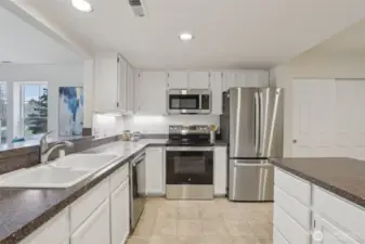 Large kitchen with freshly painted cabinetry and NEW appliances