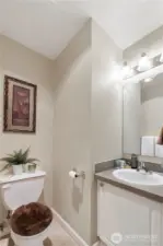 This well-placed upstairs powder room offers comfort and convenience for your guests without sacrificing privacy. Located just off the main living and dining areas, it’s easily accessible during gatherings and everyday use. With neutral finishes, a spacious vanity, and updated lighting, it provides a clean, welcoming space that makes hosting effortless.