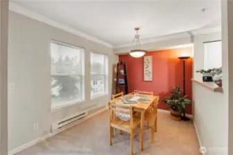 Whether hosting a dinner party or enjoying a quiet meal, this dining room offers a tranquil retreat with a backdrop of lush trees and landscaped grounds just outside. The neutral palette and clean lines make it a versatile setting to suit any décor style.