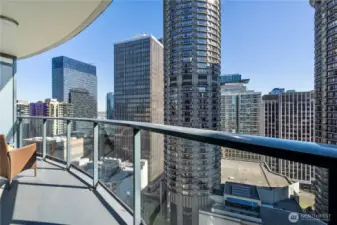 Expansive balcony with stunning views of the city skylined.