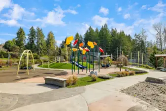 Head down a wooded path at the end of the street, and you'll pop right out onto the Baseball Fields and Owens Playground.