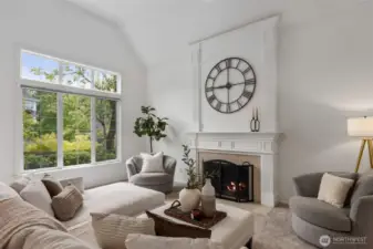Formal living room with wood burning fireplace.