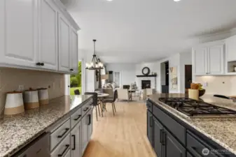Chef's kitchen complete with gas cooktop, new fridge, new Kitchenaid microwave & high performance garbage disposal.