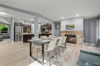 Family Room and view of kitchen area and frieplace