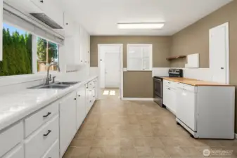 Large kitchen with ample counter space and storage.