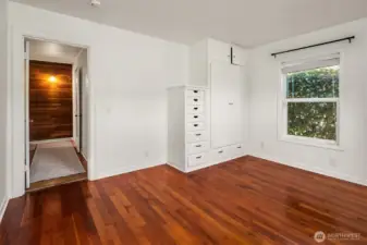Bedroom 1 featuring built in storage.