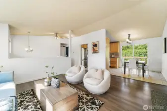Spacious living room with lots of natural light and vaulted ceiling