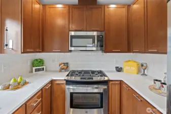 Bright and functional kitchen with ample storage and stainless steel appliances.