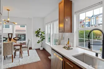 Dining area adjacent to kitchen, offering great natural light and open flow for entertaining.