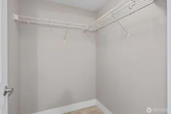 Spacious walk-in closet offering ample storage and organization options.