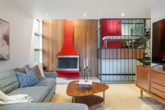 Iconic fireplace anchors the spacious living room.