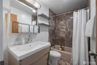 Updated primary bathroom with classic finishes.