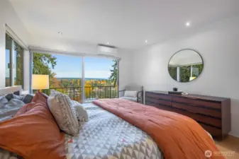 Cozy, bright bedroom with beautiful views.