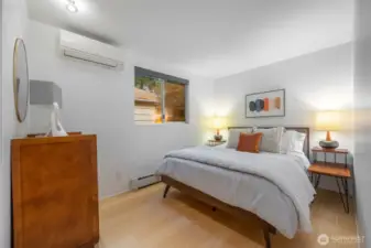 Main floor bedroom is perfect as a guest suite with privacy and natural light.