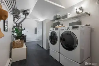 Laundry area with shelving for your organization needs.