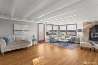 Enjoy views of Commencement Bay from the bright living room with a door to the deck.